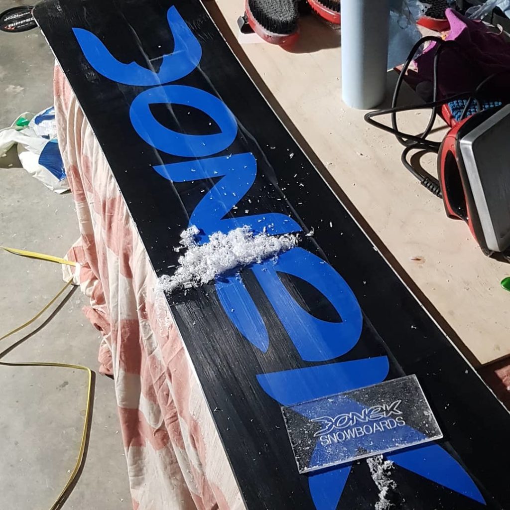 Base cleaning and wax prep Custom Snowboards
